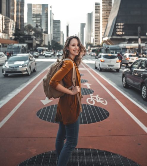 woman standing on middle of road